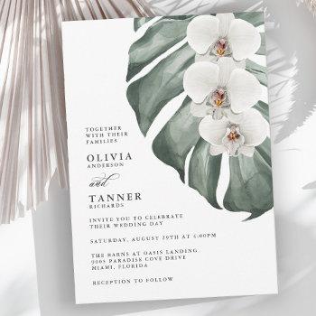 white orchids on monstera tropical wedding invitation