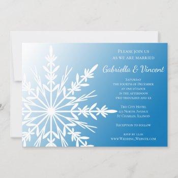 white snowflake on blue winter wedding invitation